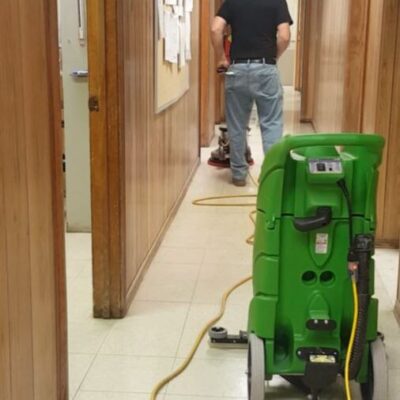janitor scrubbing a floor